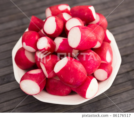 cooked crispy radish in white bowl on wooden table cooked crispy radish in white bowl on wooden table 86176517
