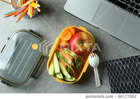 Study concept with lunch box on gray textured table 86177002
