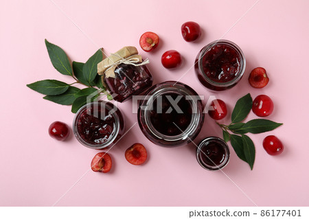 Cherry jam and ingredients on pink background 86177401
