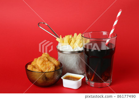Concept of fast food on red background Concept of fast food on red background 86177490