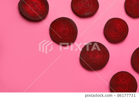 Chopped ripe red beet on pink background Chopped ripe red beet on pink background 86177731