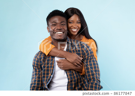 African American lady cuddling with her man 86177847