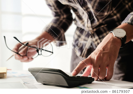 Business man or accountant working with laptop computer Business man or accountant working with laptop computer 86179307
