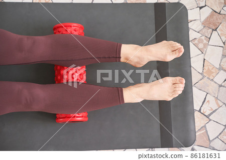 Young woman stretch body on fitness mat. Myofascial release massage 86181631