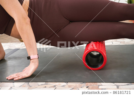 Young woman stretch body on fitness mat. Myofascial release massage 86181721