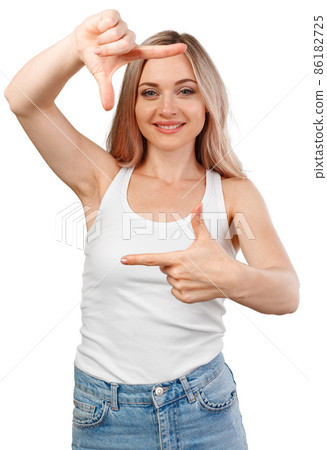 Close up of happy young girl showing frame with fingers isolated on white 86182725