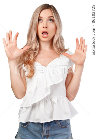 Surprised young woman shouting over white isolated background Surprised young woman shouting over white isolated background 86182728