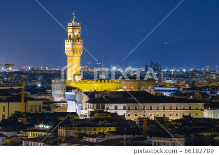 Night view of the Arnolfo Tower of Palazzo Vecchio on Signoria square. Italian renaissance. Shot from Michelangelo square. Florence, Tuscany - 12 Jan 2022 Night view of the Arnolfo Tower of Palazzo Vecchio on Signoria square. Italian renaissance. Shot from Michelangelo square. Florence, Tuscany - 12 Jan 2022 86182789