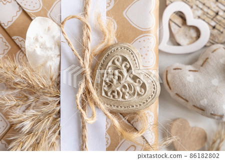 Valentines present decorated with heart and pampass grass top view Valentines present decorated with heart and pampass grass top view 86182802