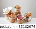 Dirty used disposable bowls and boxes on a light background. Unsustainable concept 86182976