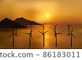 Wind turbines, ecological power generators, standing in the water with distant mountains. Beautiful golden sea sunset. 86183011