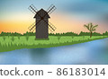 Wooden windmill on the green camp near the blue river. 86183014