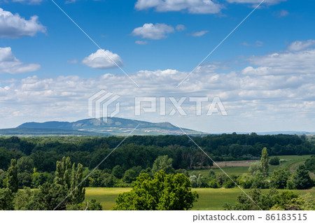 Lednice-Valtice complex, view from Minaret-observation tower for park with trees, on background limestone Palava hills Lednice-Valtice complex, view from Minaret-observation tower for park with trees, on background limestone Palava hills 86183515