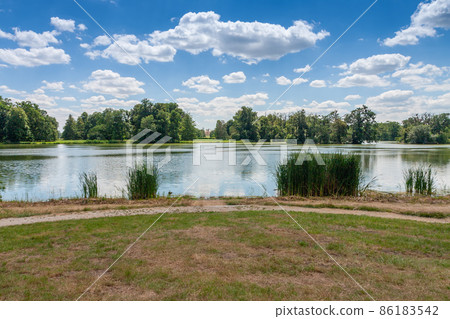 Lednice-Valtice complex, castle pond , park with trees and castle Lednice Lednice-Valtice complex, castle pond , park with trees and castle Lednice 86183542