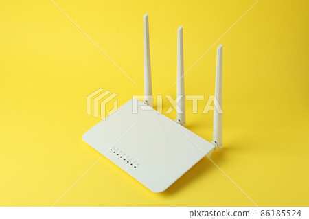 Wi-Fi router with external antennas on yellow background 86185524