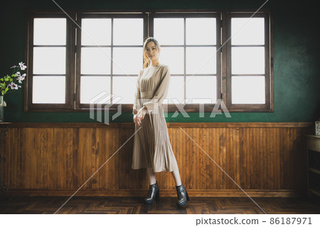 Woman in a beige dress 86187971