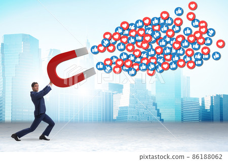 Businessman attracting likes with large magnet 86188062