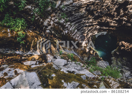 Wild Waterfall and Cliffs of Karst Gorge Wild Waterfall and Cliffs of Karst Gorge 86188254