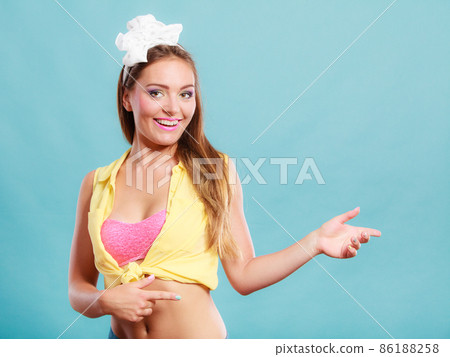 Happy pin up girl with showing empty copy space. Happy pin up girl with showing empty copy space. 86188258