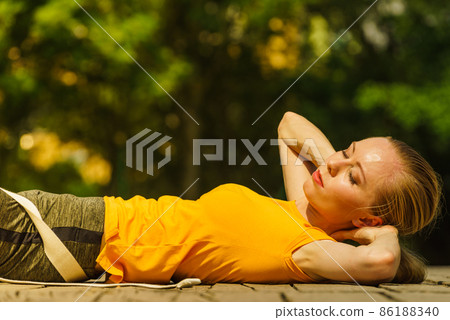 Girl relaxing after exercise gym outdoor 86188340