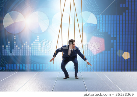 Businessman puppet being manipulated by ropes 86188369