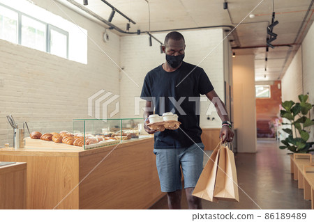 Black man going with orders of people on corridor Black man going with orders of people on corridor 86189489