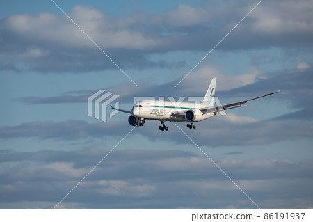 Zip air aircraft ready to land at Narita Airport 86191937