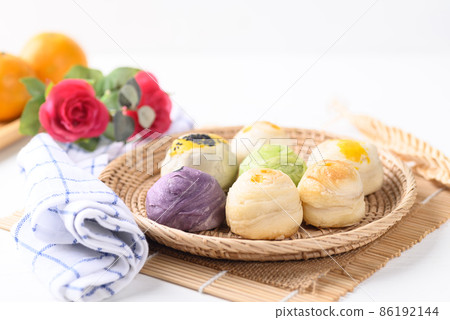 Chinese pastry stuffed with many sweet such as mung bean, egg yolk or custard 86192144