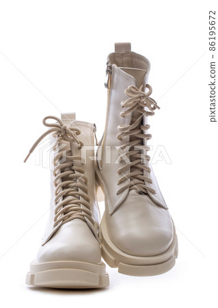 Female winter boots on high soles on a white background 86195672