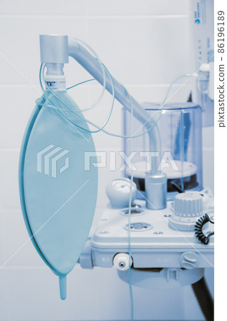 Empty operating room in a hospital. Surgical equipment with operating table. Medical device for emergency patient in blue tone style. Blank Emergency Surgery Room. Clinic interior for background. 86196189