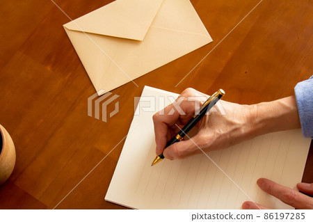 Image of writing letters on stationery and envelopes Image of writing letters on stationery and envelopes 86197285