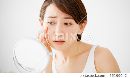 Beauty image Young woman doing skin care Beauty image Young woman doing skin care 86199042