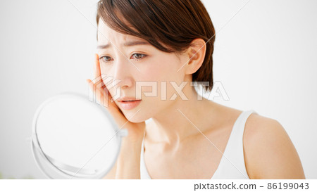 Beauty image Young woman doing skin care Beauty image Young woman doing skin care 86199043