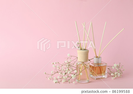 Aromatic concept with diffusers on pink background Aromatic concept with diffusers on pink background 86199588