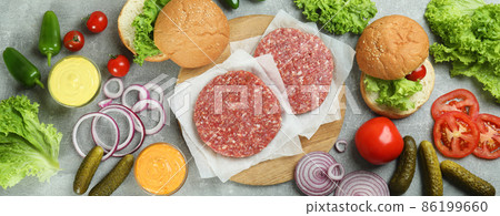Concept of cooking burger on gray textured table Concept of cooking burger on gray textured table 86199660