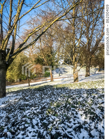 Buttes-Chaumont Park under the snow in winter, Paris 86200409