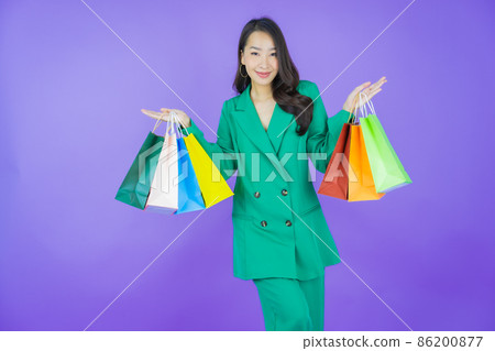 Portrait beautiful young asian woman smile with shopping bag 86200877
