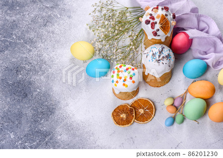 Easter cake and Easter eggs festive celebration table setting traditional decoration and treats Easter cake and Easter eggs festive celebration table setting traditional decoration and treats 86201230