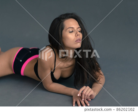 Young and beautiful dancer posing in studio Young and beautiful dancer posing in studio 86202102