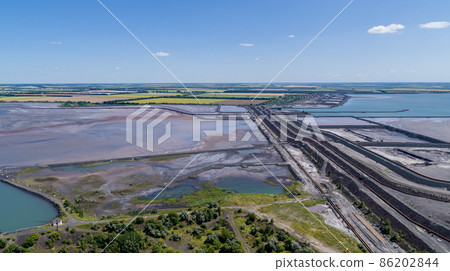 Tailing dump in industrial city aerial view 86202844