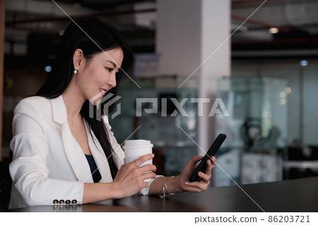 A businesswoman completes KYC using an online banking program in order to open a digital savings account. The definition of cyber security A businesswoman completes KYC using an online banking program in order to open a digital savings account. The definition of cyber security 86203721