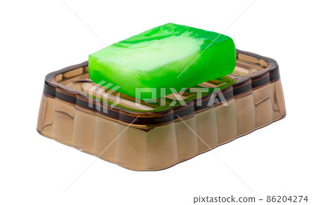 New soap on a dish isolated on white background New soap on a dish isolated on white background 86204274