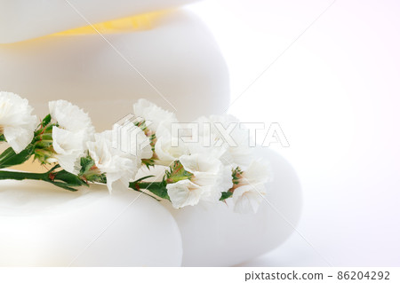 Soap bars with flowers on white surface 86204292