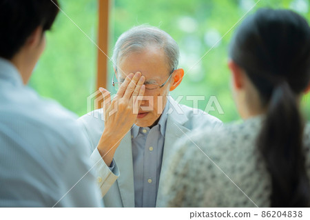 Senior man and young couple talking 86204838