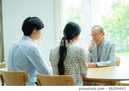Senior man and young couple talking 86204841