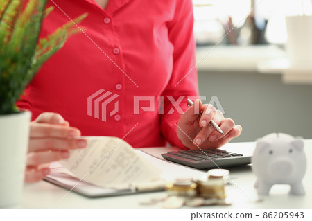 Accountant count on black calculator, cash coin on office workplace Accountant count on black calculator, cash coin on office workplace 86205943