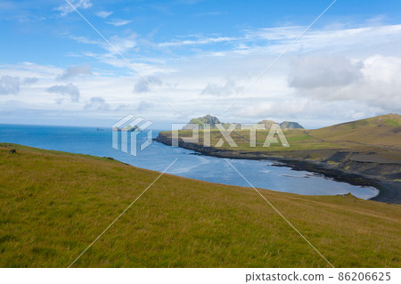 Vestmannaeyjar island beach day view, Iceland landscape. Vestmannaeyjar island beach day view, Iceland landscape. 86206625