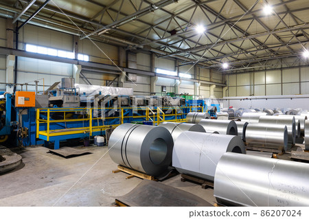 Photo of steel roofing forming machine. Industrial machine for metal sheet roof coils cut. Factory Photo of steel roofing forming machine. Industrial machine for metal sheet roof coils cut. Factory 86207024
