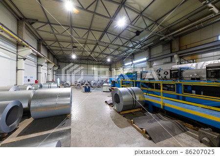 Photo of steel roofing forming machine. Industrial machine for metal sheet roof coils cut. Factory Photo of steel roofing forming machine. Industrial machine for metal sheet roof coils cut. Factory 86207025