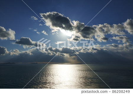 Dynamic landscape created by winter sky and sea, afternoon sun and clouds 86208249